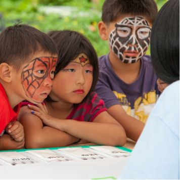 children with fun face paint